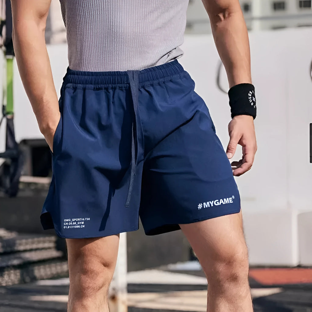 Men's grey compression fitness shorts with four-point design for summer training