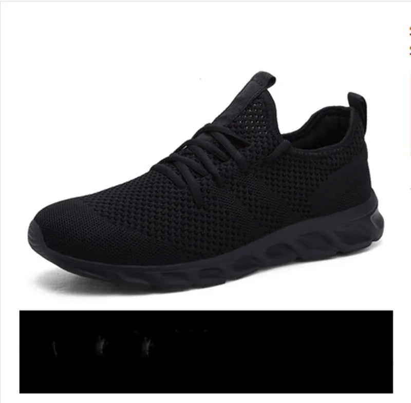 Men's black and white mesh casual sneaker with PVC sole and lace-up closure on a plain background.