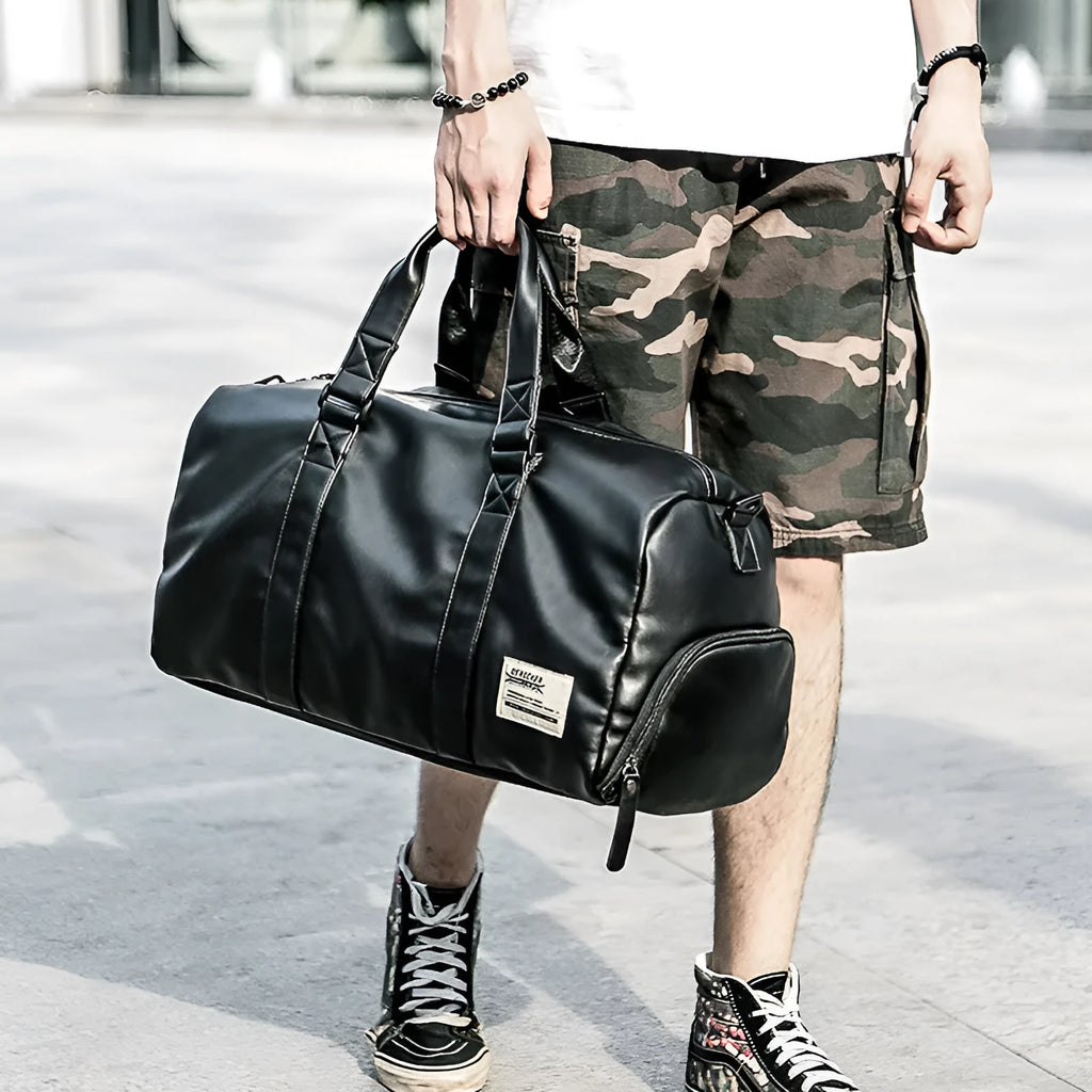Large black waterproof PU leather sports training bag showing multiple internal organiser pockets.