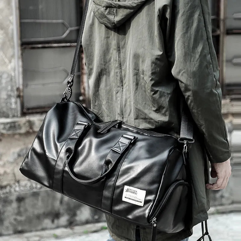 Large black waterproof PU leather sports training bag showing multiple internal organiser pockets.