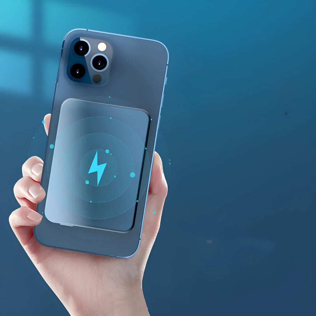 Silver aluminium magnetic wireless charging power bank with USB-C port, shown next to a mobile phone.