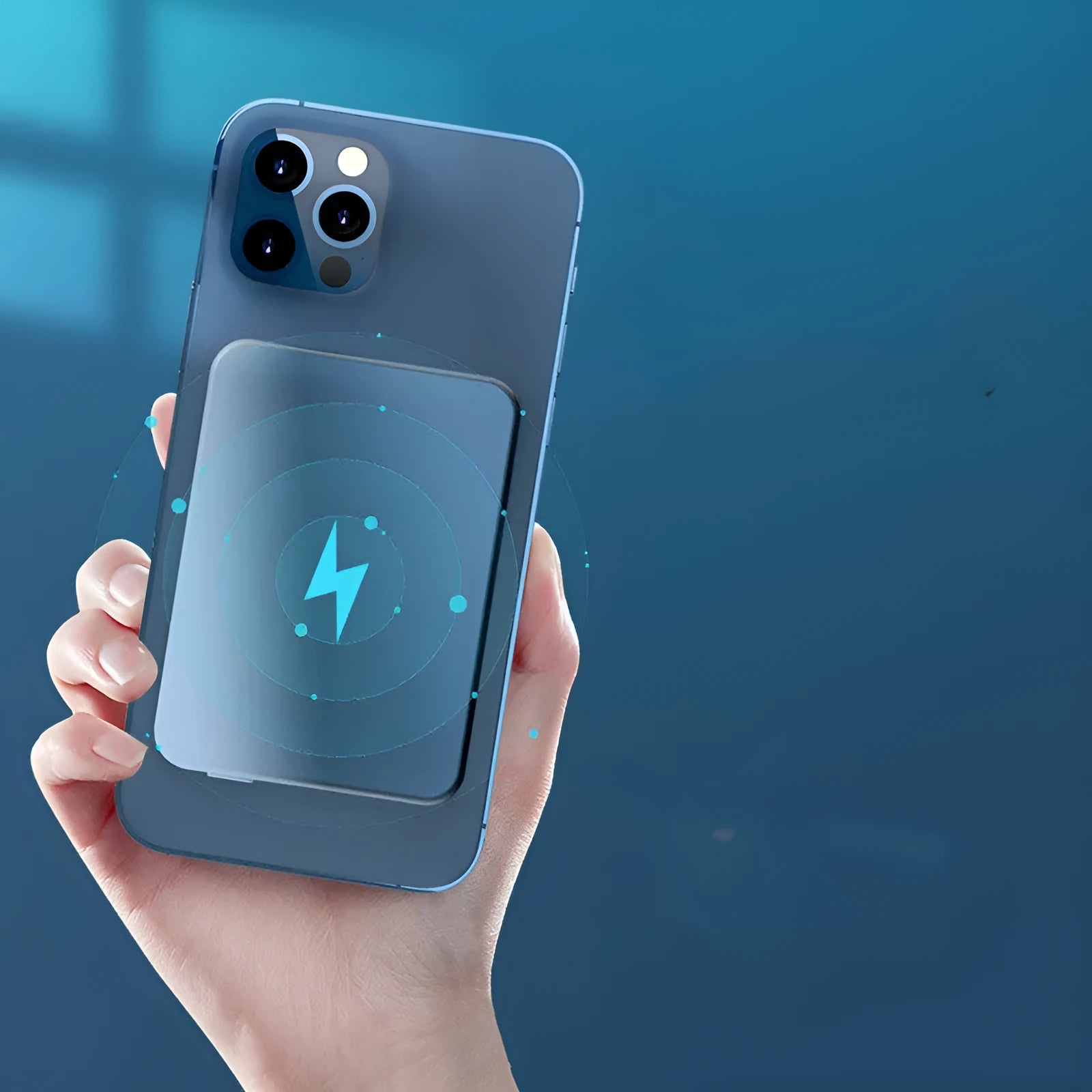 Silver aluminium magnetic wireless charging power bank with USB-C port, shown next to a mobile phone.
