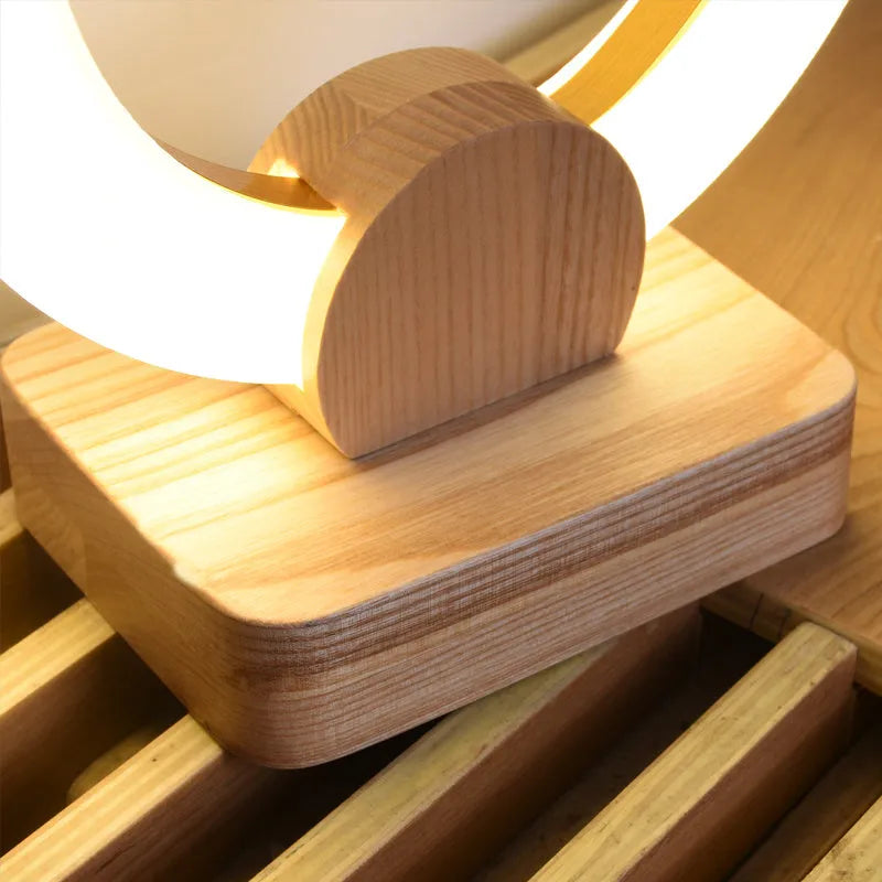 Wooden circular Nordic style chandelier with acrylic shade in living room setting