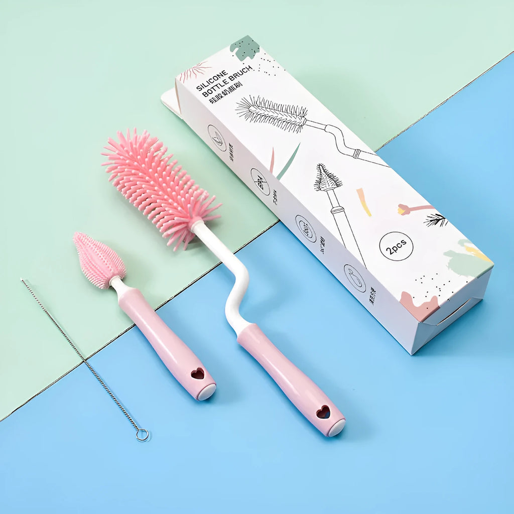 Three-piece baby bottle cleaning brush set with silicone bristles and a straw cleaner in assorted colours.