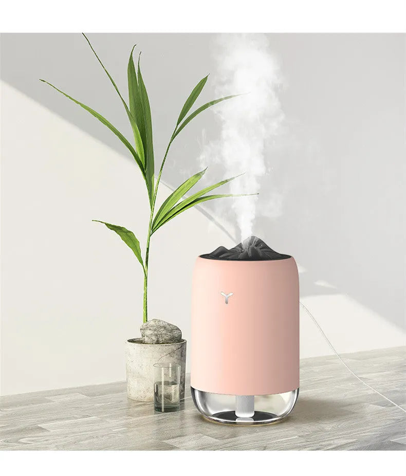 White Magic Flame ultrasonic humidifier diffuser with columnar design and single mist outlet on a desktop
