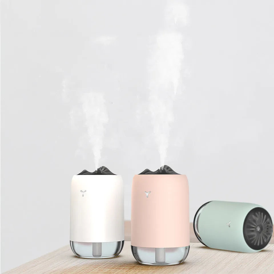 White Magic Flame ultrasonic humidifier diffuser with columnar design and single mist outlet on a desktop