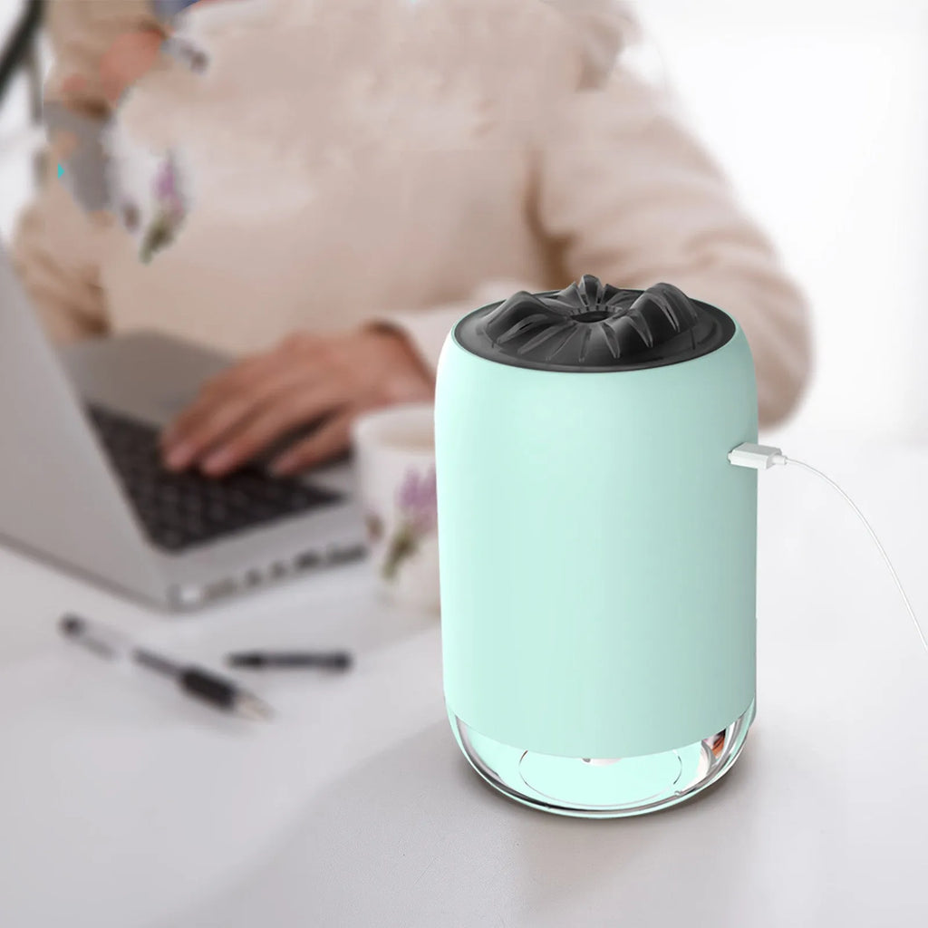 White Magic Flame ultrasonic humidifier diffuser with columnar design and single mist outlet on a desktop