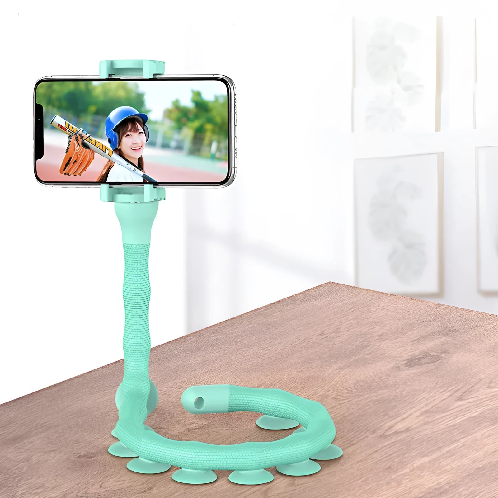 Flexible worm design mobile phone holder with suction cup mounted on desktop showing 360-degree rotation