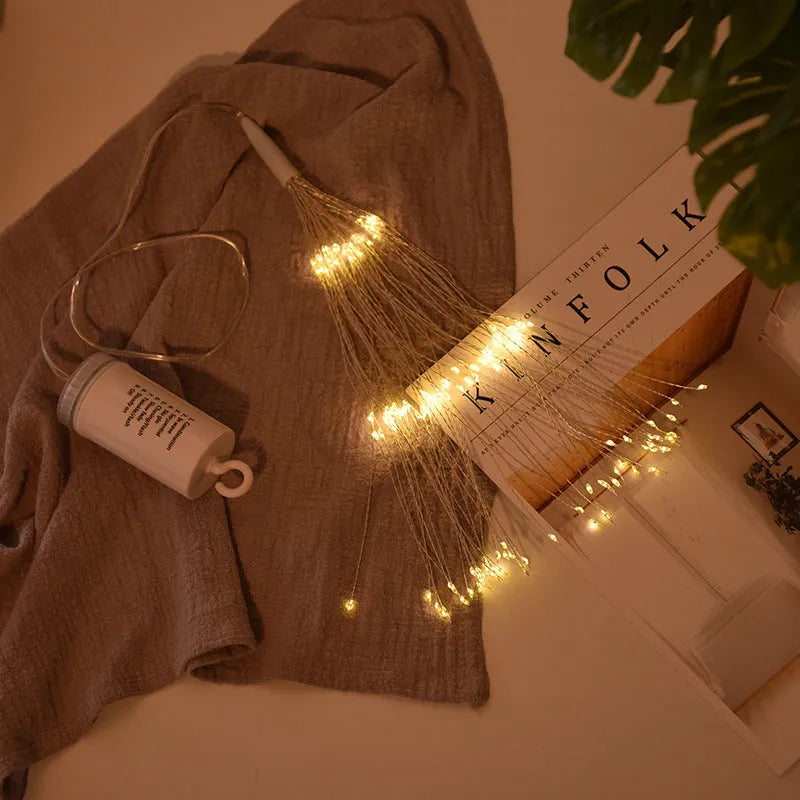 Solar-powered LED meteor shower lights hanging outdoors with warm white cascade lighting effect