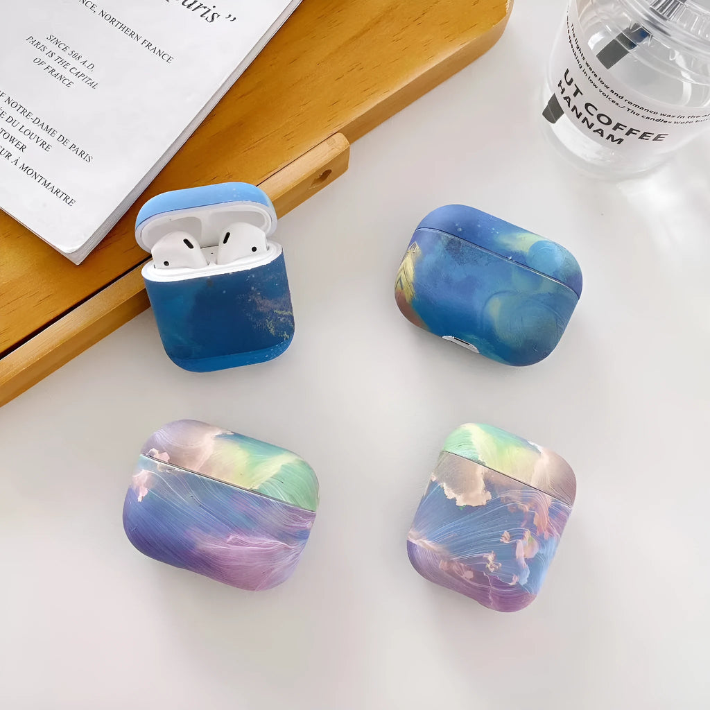 Pink and blue watercolour pattern hard plastic protective sleeve for Apple AirPods charging case.