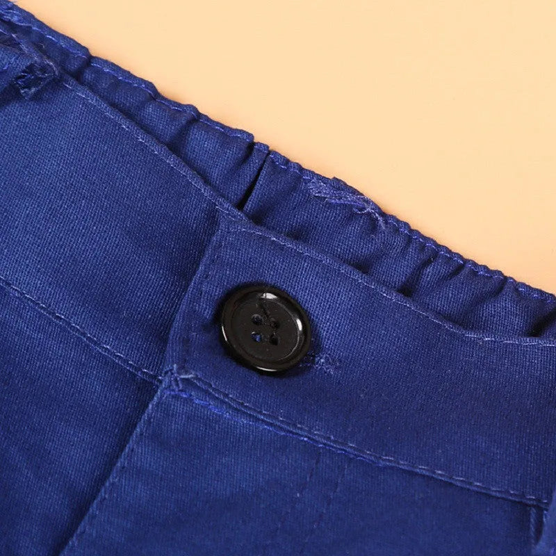 Blue boys' clothing set with turtleneck, waistcoat, tie, and trousers on a hanger.