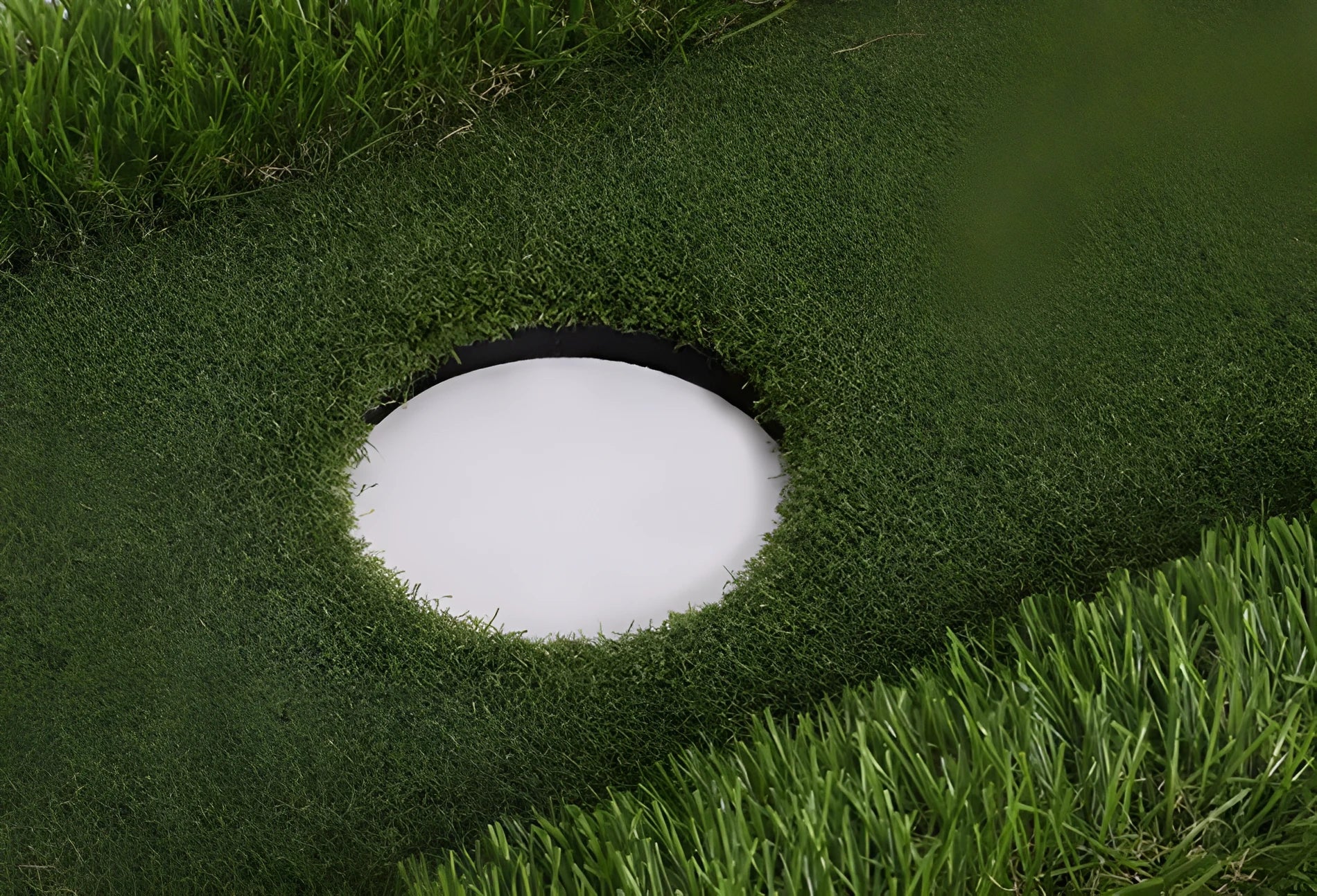Green golf training mat with synthetic grass surface on a high elastic EVA foam base.