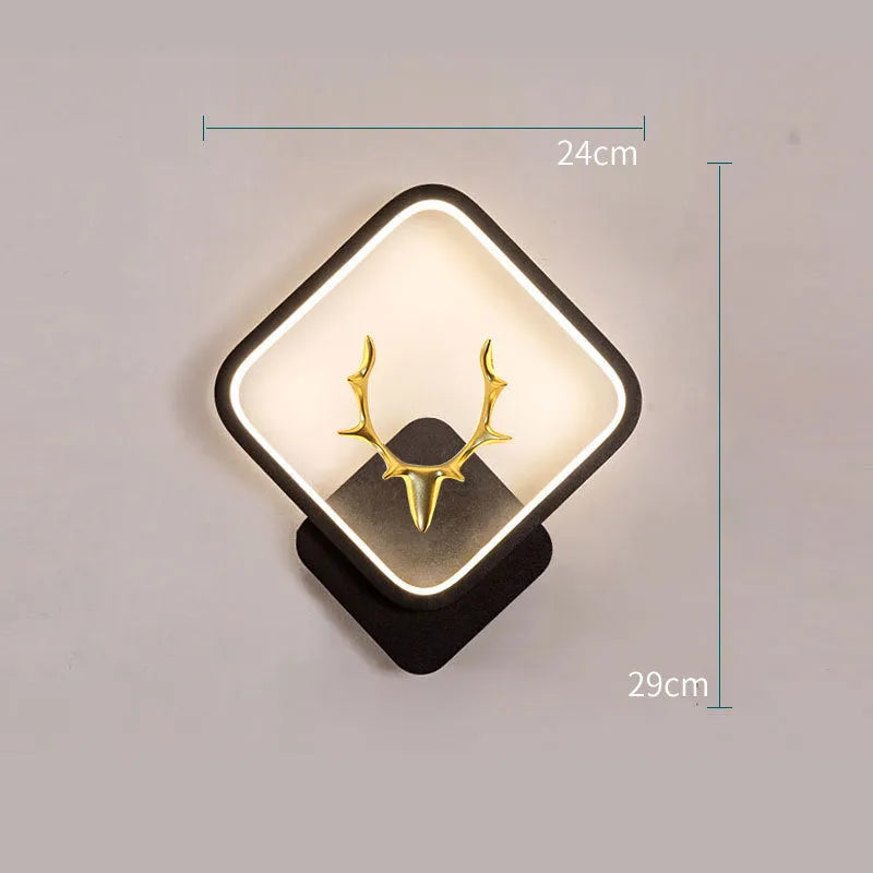 Deer antler shaped wall lamp with remote control on a light coloured wall