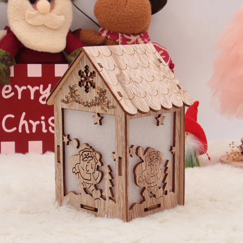 Three wooden Christmas house ornaments: small log bell, large Father Christmas house, large snowman house