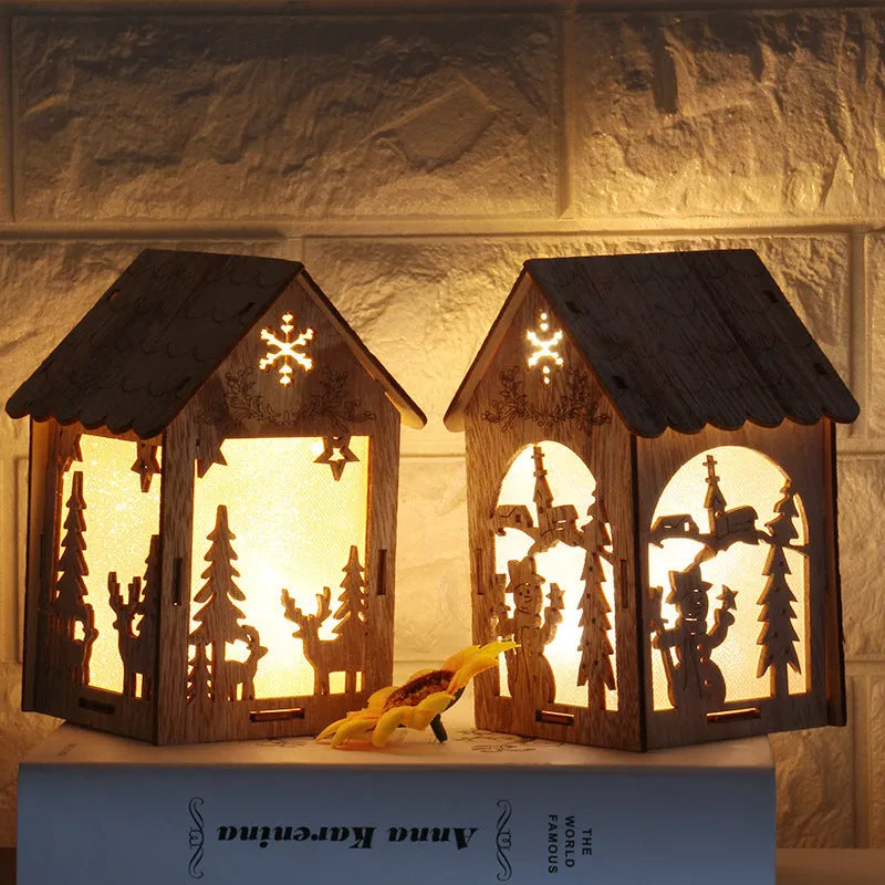 Three wooden Christmas house ornaments: small log bell, large Father Christmas house, large snowman house