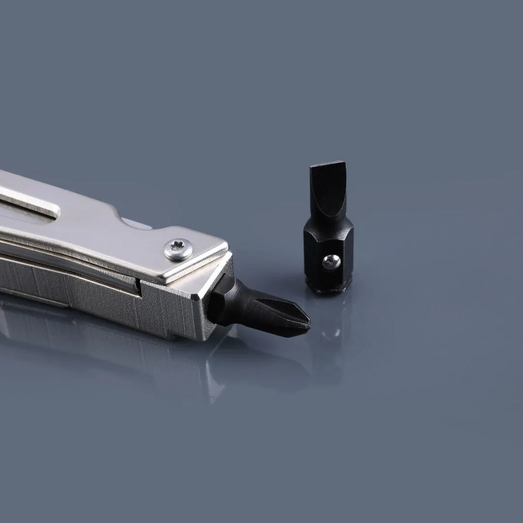 White stainless steel multi-function tool showing wrench, knife blade, and needle-nose pliers heads.