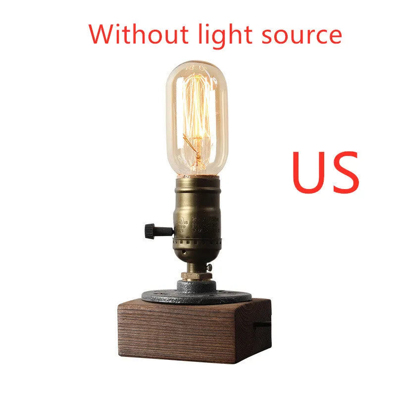 Small wooden and iron water pipe shaped table lamp on a table