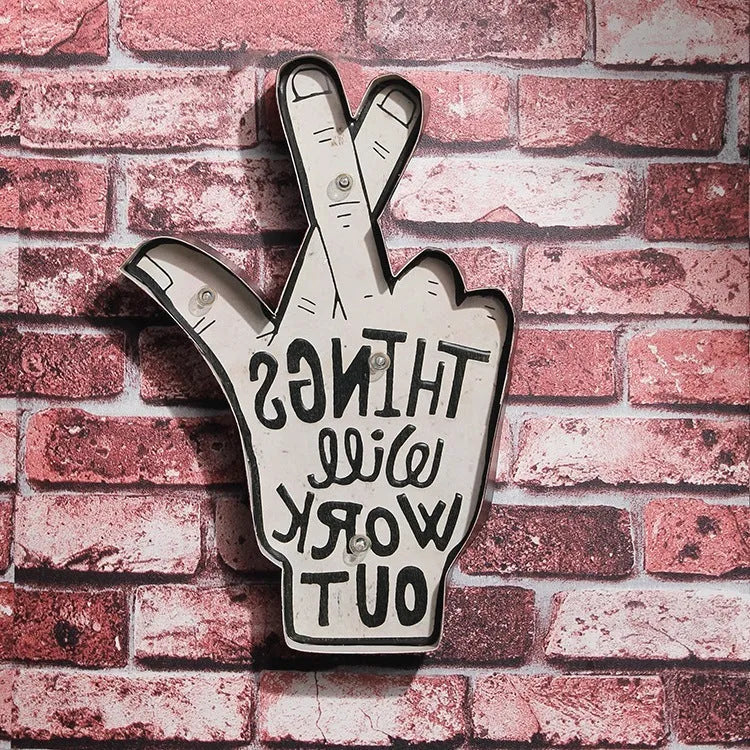 Shapeable vintage-style LED neon sign being bent to form a custom design on a wall.