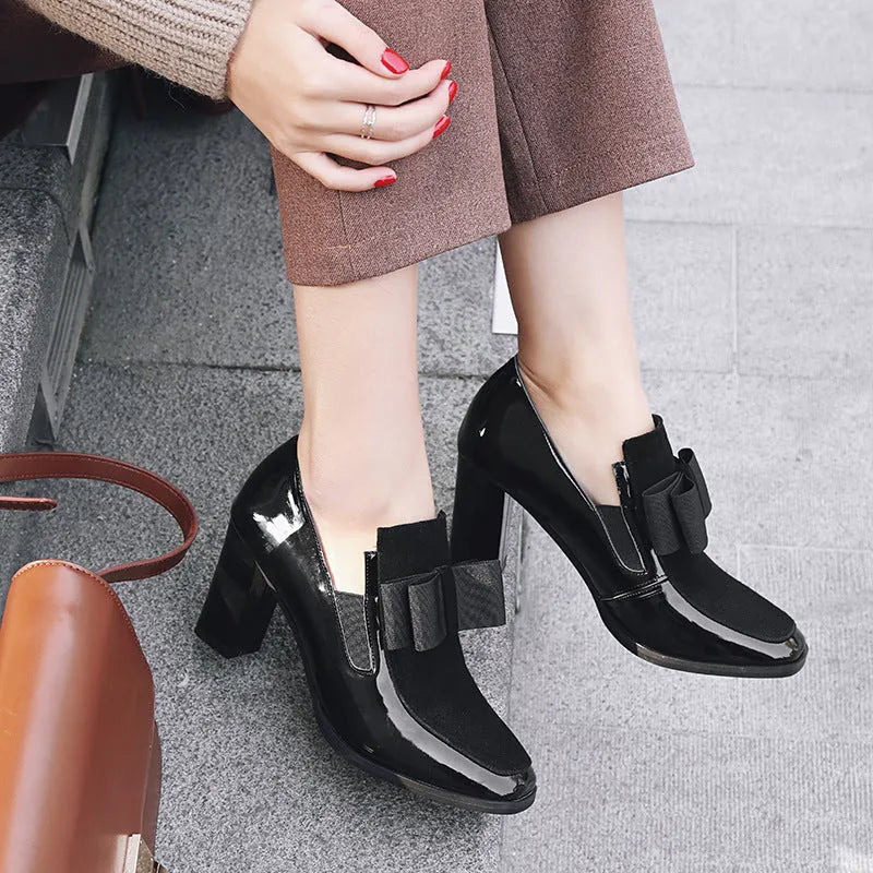 Women's black patent leather high heels with thick heel and square toe design