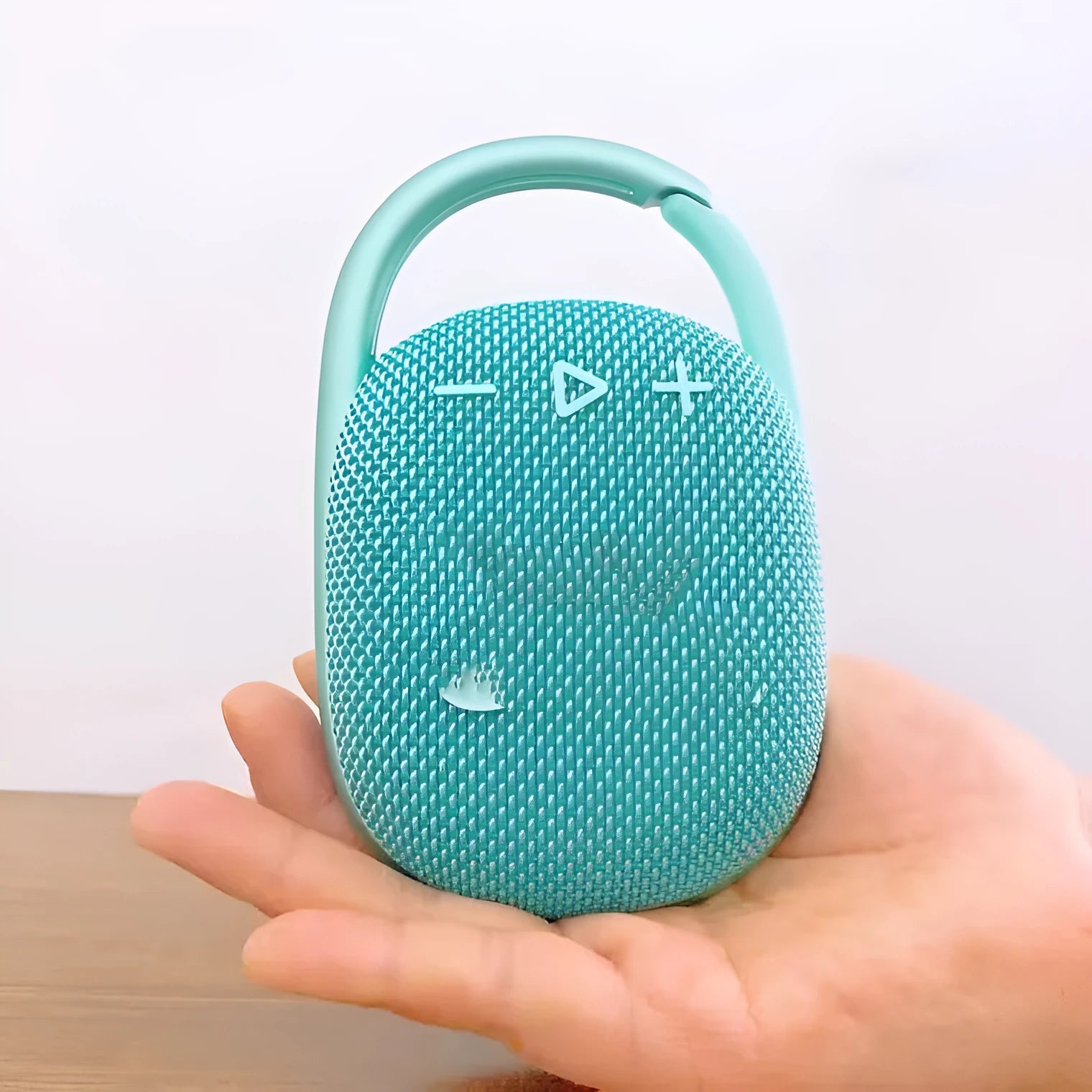 Mini portable Bluetooth speaker in multiple colours including pink, blue, black, red, silver grey, and green.