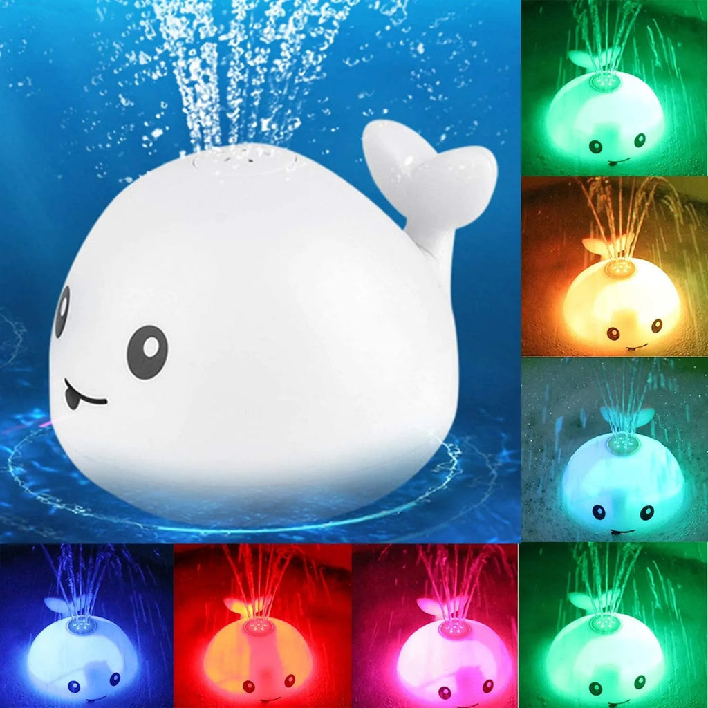 White and blue whale-shaped electric bath toy with water spray fountain and LED lights