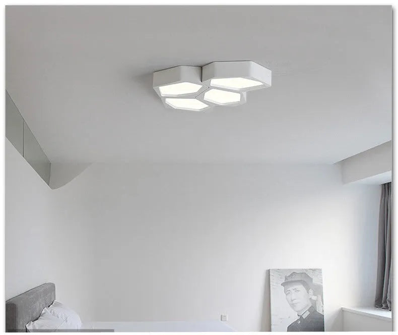 Geometric patterned LED wall light panel with iron frame in black or white finish