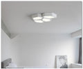 Geometric patterned LED wall light panel with iron frame in black or white finish