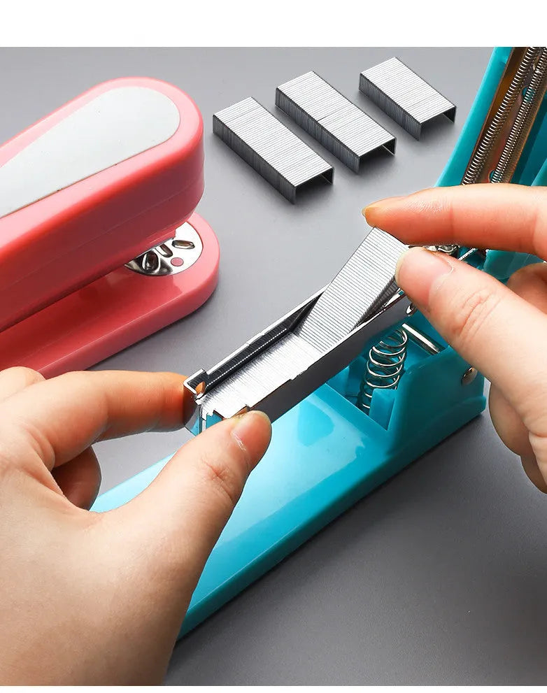 360-degree rotatable desktop stapler in black, showing rotation function and centre seam binding.