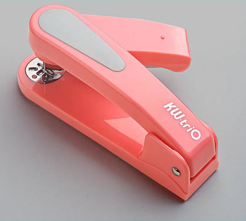 360-degree rotatable desktop stapler in black, showing rotation function and centre seam binding.