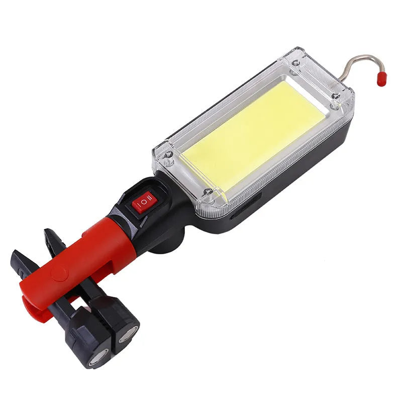 Portable flashlight with magnetic hook showing USB charging port and COB LED light
