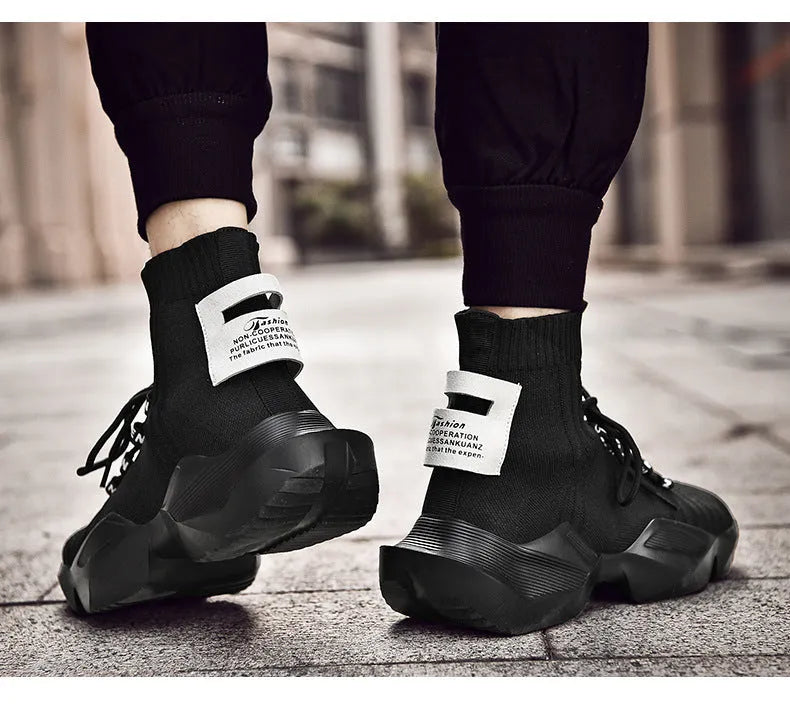 Men's black and white sports casual shoes showing mesh inside and extended sizing options