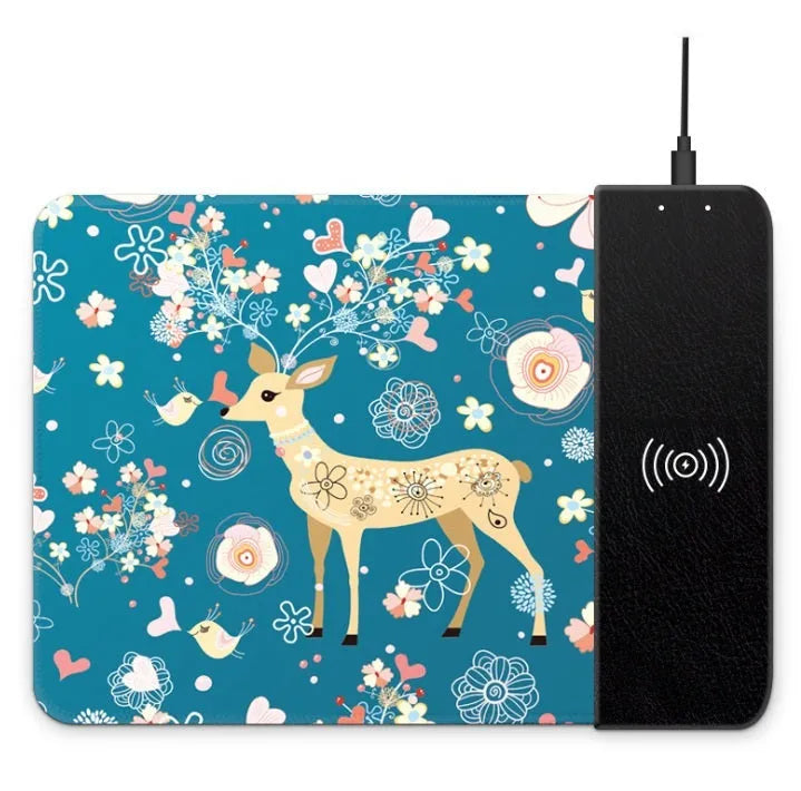 Black wireless charging mouse pad with RGB edge lighting and a white cartoon dot pattern on a desk.