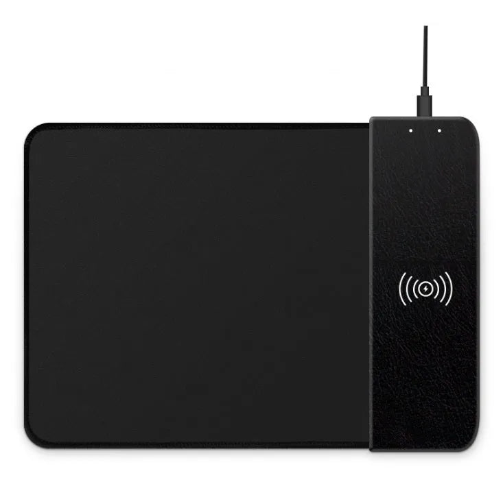 Black wireless charging mouse pad with RGB edge lighting and a white cartoon dot pattern on a desk.