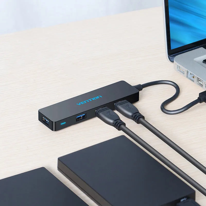 Black four-port USB 3.0 hub with 0.15 metre cable showing nickel-plated interfaces