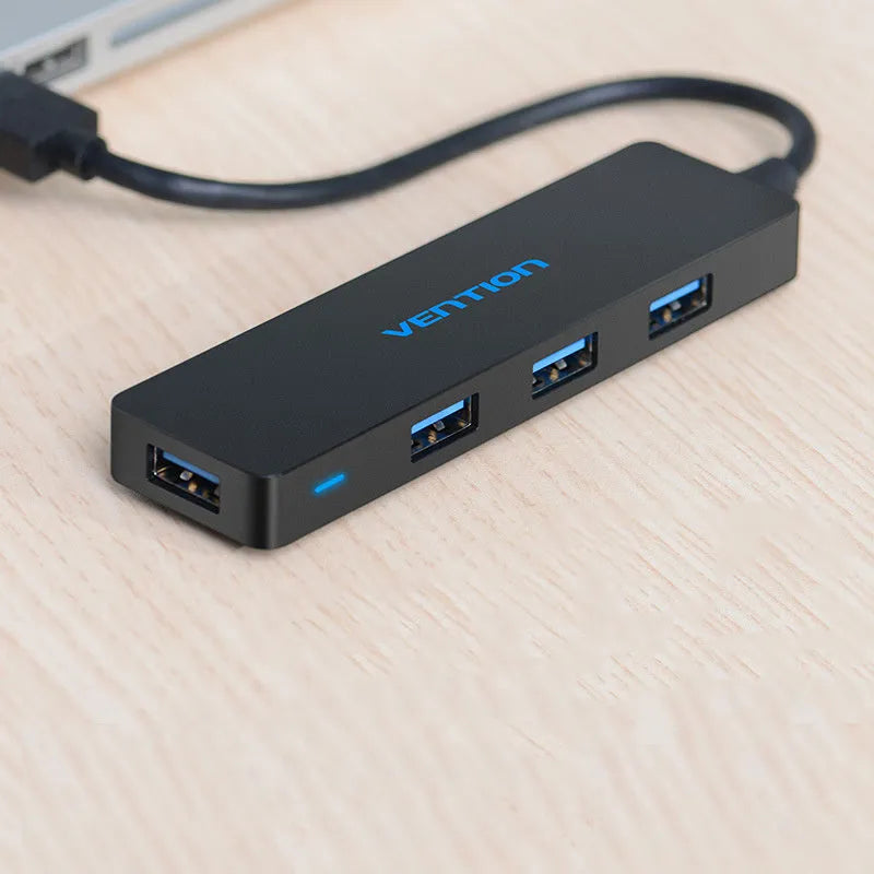 Black four-port USB 3.0 hub with 0.15 metre cable showing nickel-plated interfaces