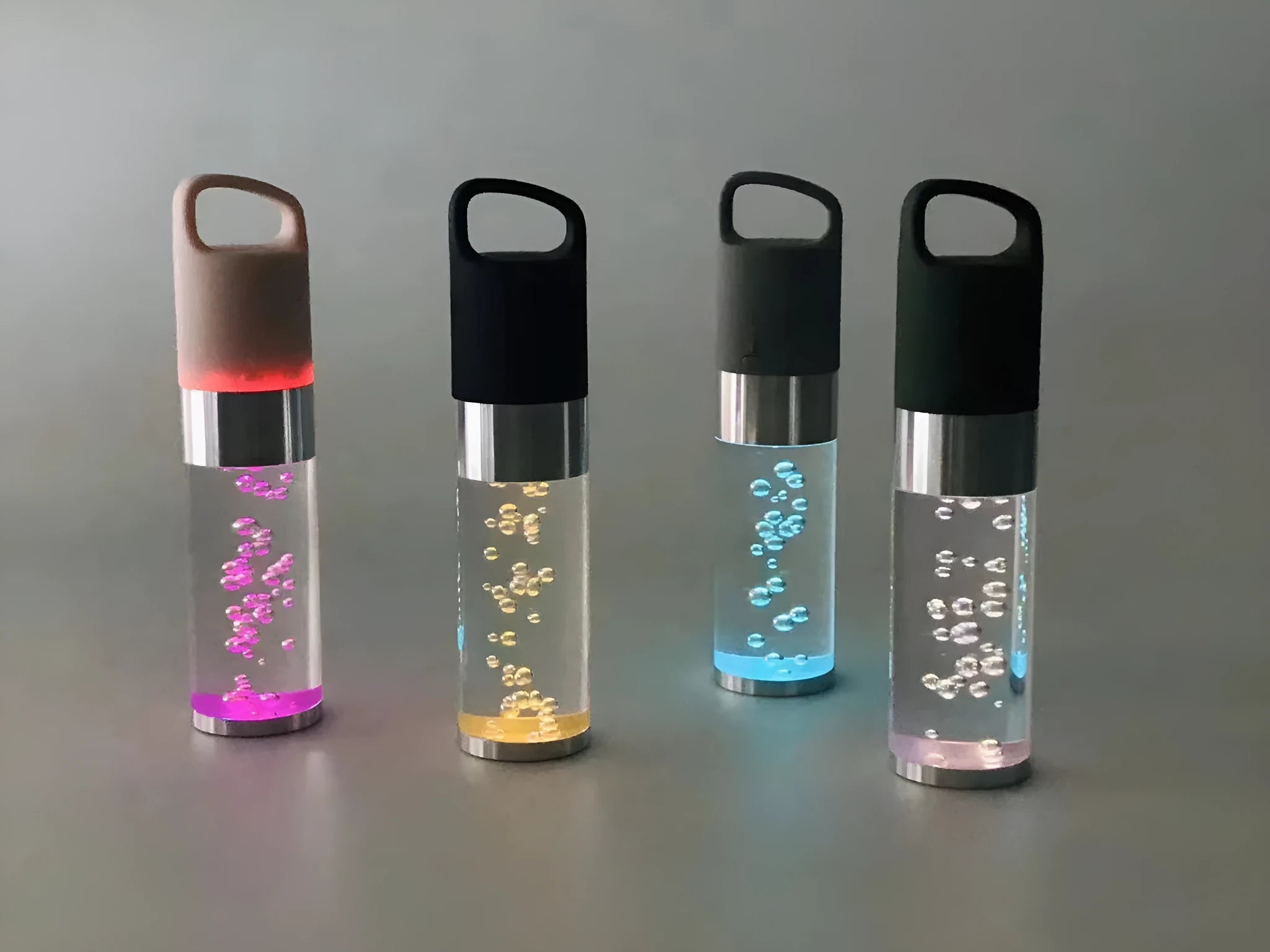 Portable Bluetooth speaker with colourful crystal lights in pink, black, silver grey, or green options