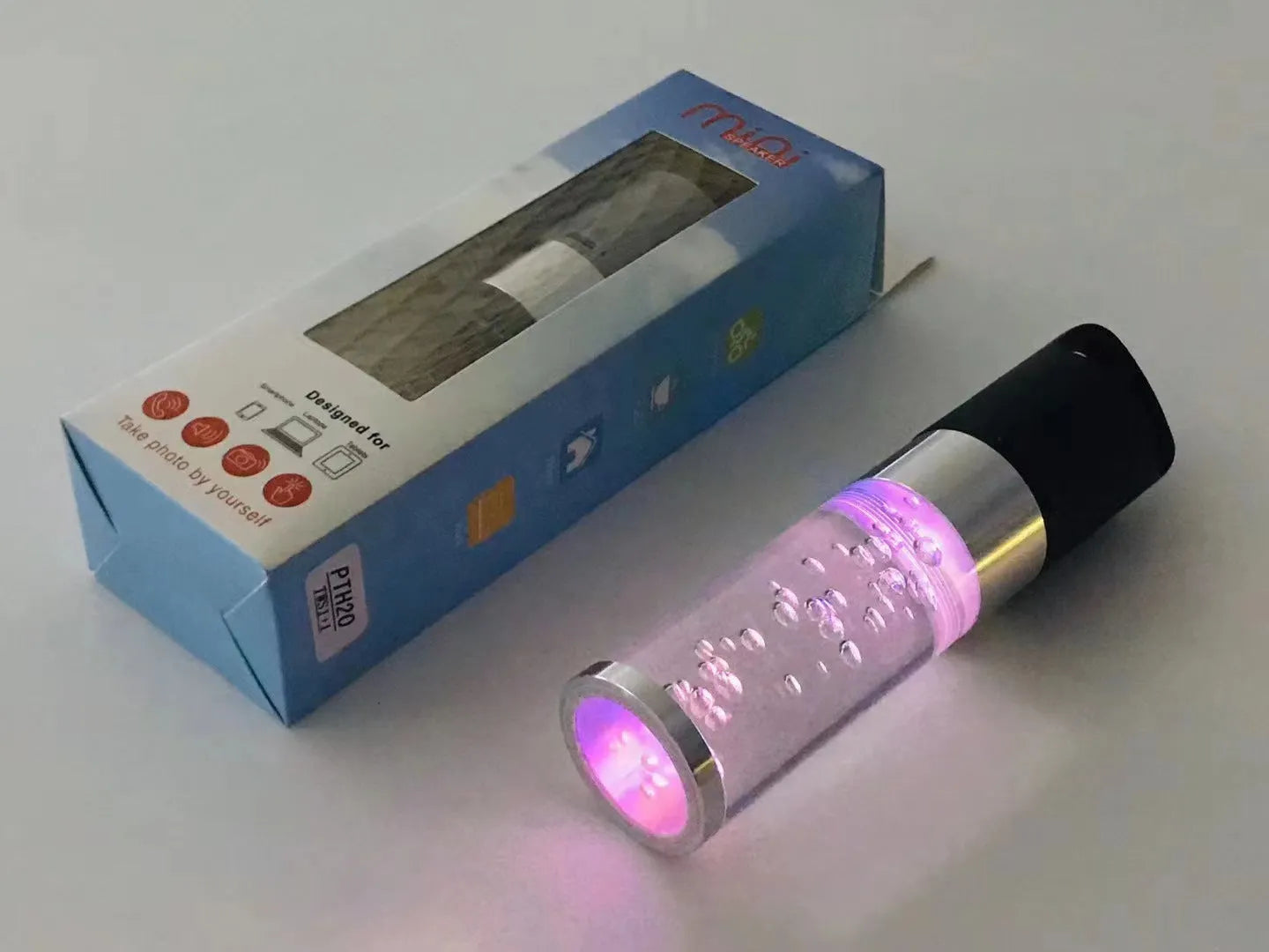 Portable Bluetooth speaker with colourful crystal lights in pink, black, silver grey, or green options