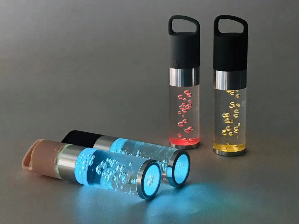 Portable Bluetooth speaker with colourful crystal lights in pink, black, silver grey, or green options