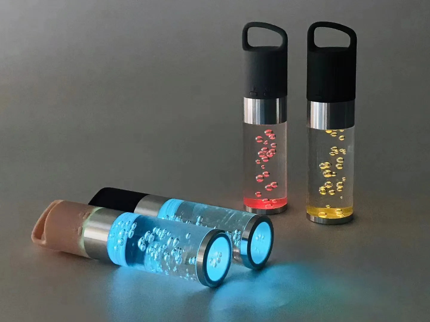Portable Bluetooth speaker with colourful crystal lights in pink, black, silver grey, or green options
