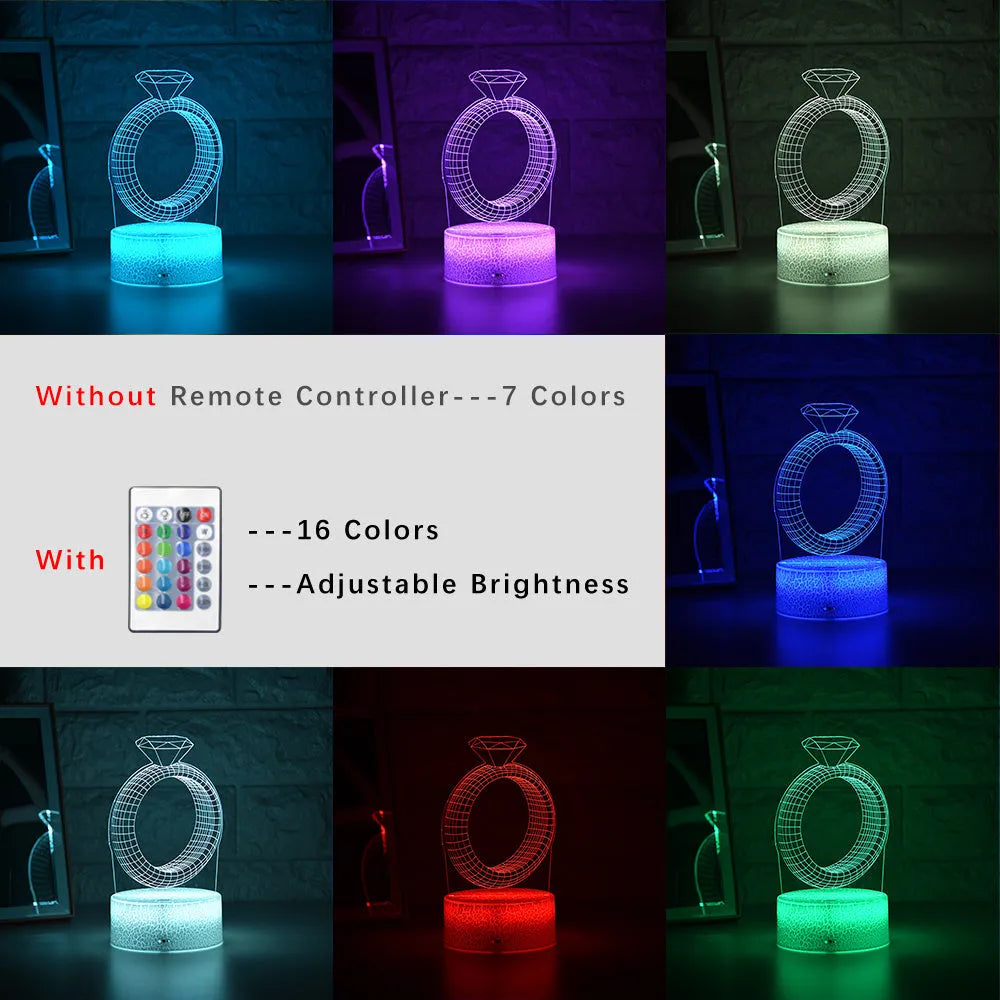 3D diamond ring LED night light with colour-changing illumination on a black base.