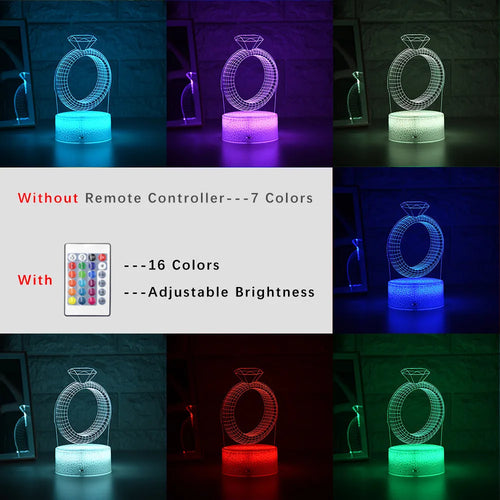 3D diamond ring LED night light with colour-changing illumination on a black base.