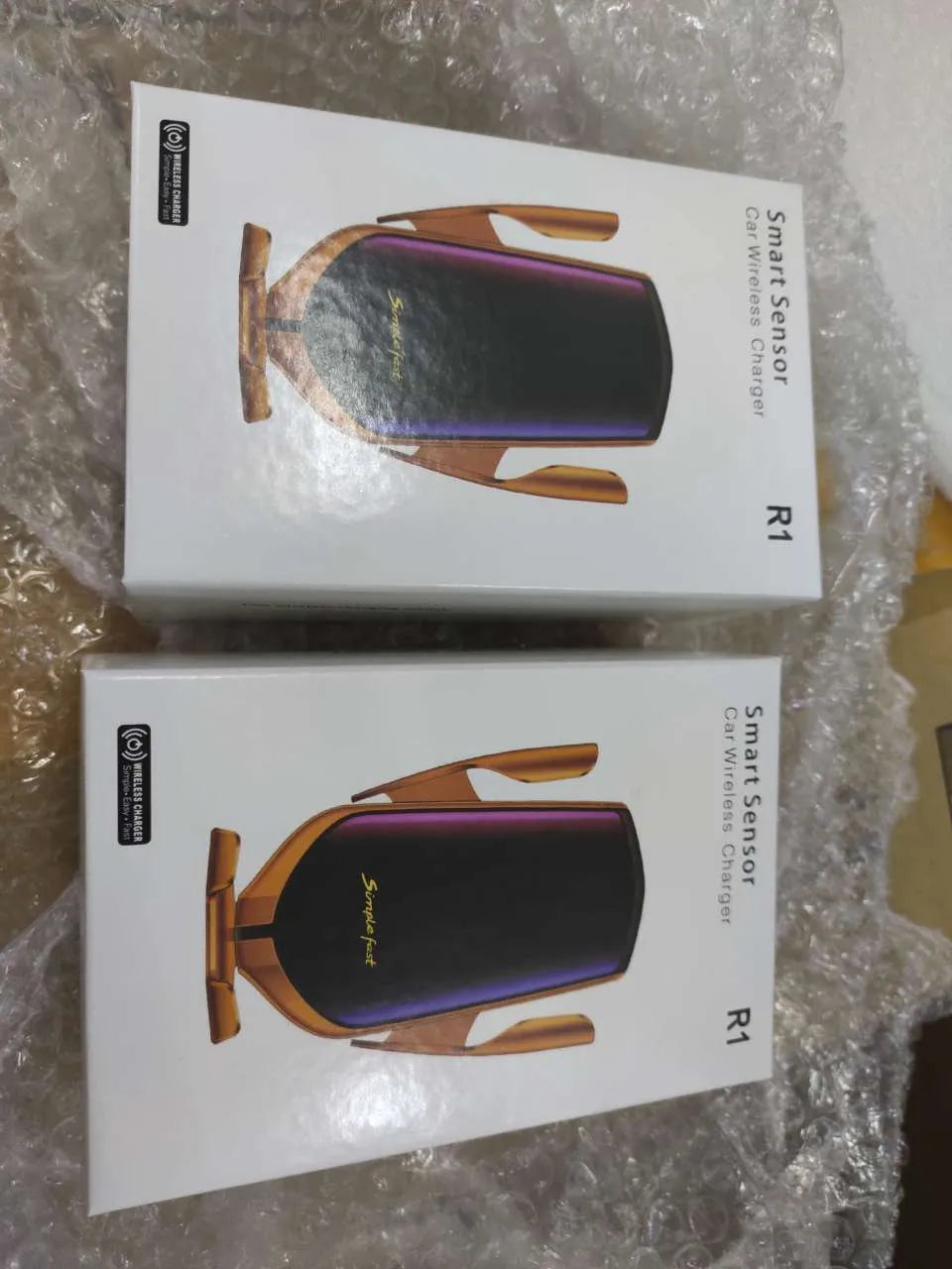 Magic Clip R1 automatic wireless charging car phone holder in gold mounted on dashboard