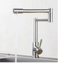 Silver stainless steel kitchen tap with two handles and rotating spout