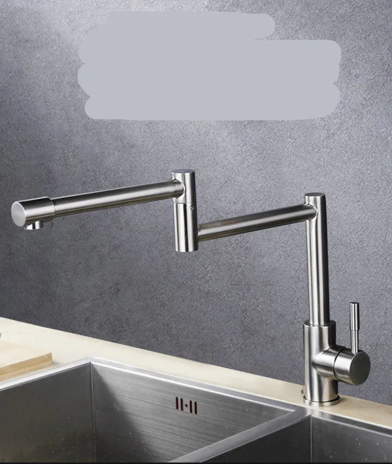 Silver stainless steel kitchen tap with two handles and rotating spout