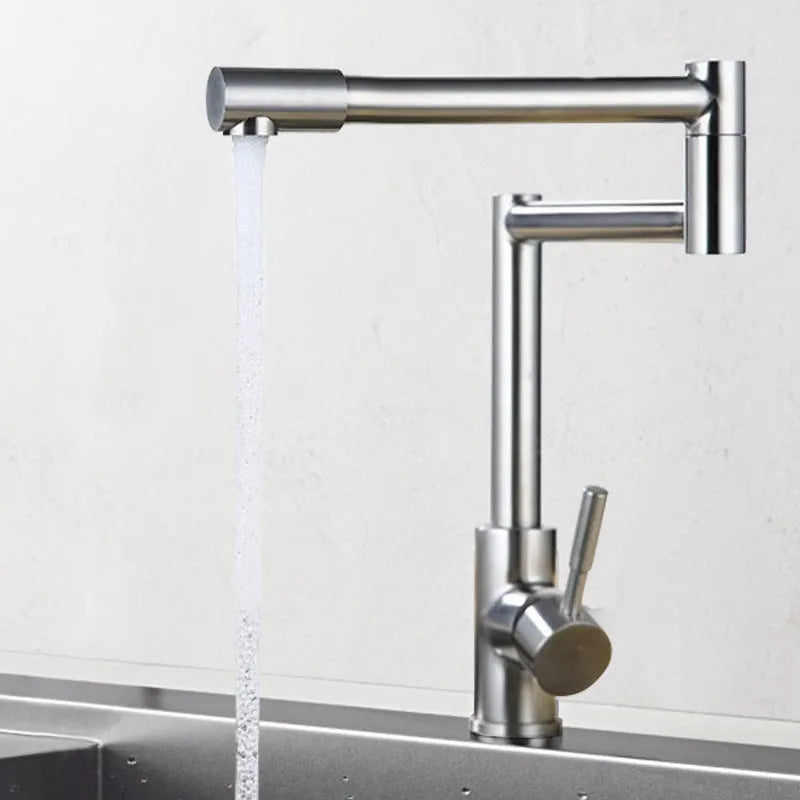 Silver stainless steel kitchen tap with two handles and rotating spout