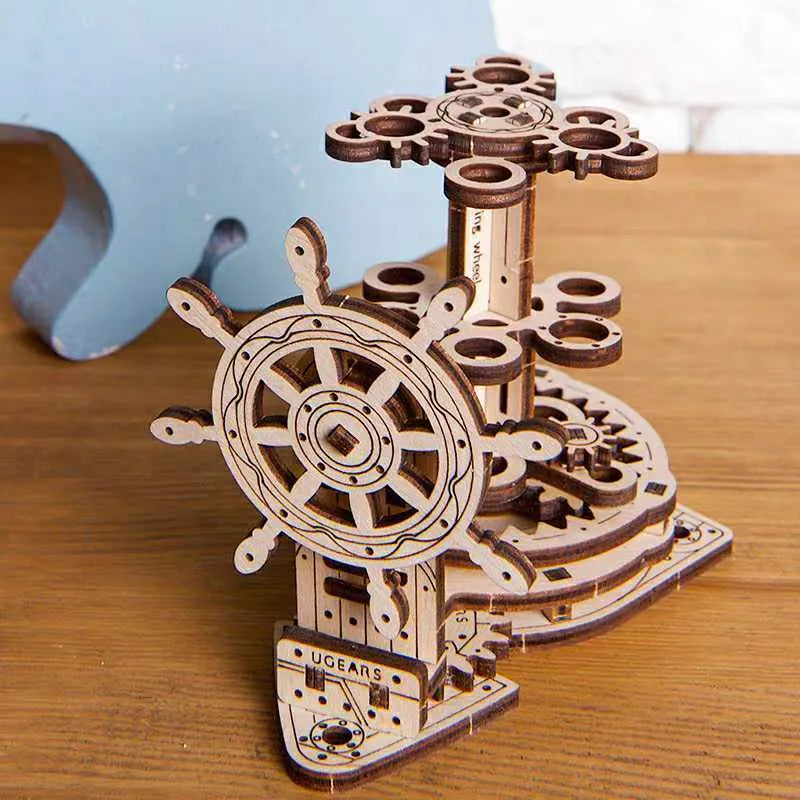 Ukrainian handmade wooden rotating pen holder with steering wheel mechanism on desk