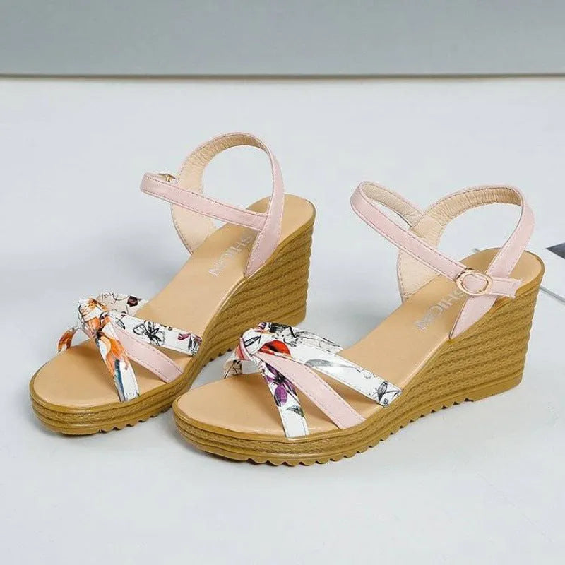 Women's pink PU wedge sandals with a thick heel, fish mouth toe, and buckle strap.