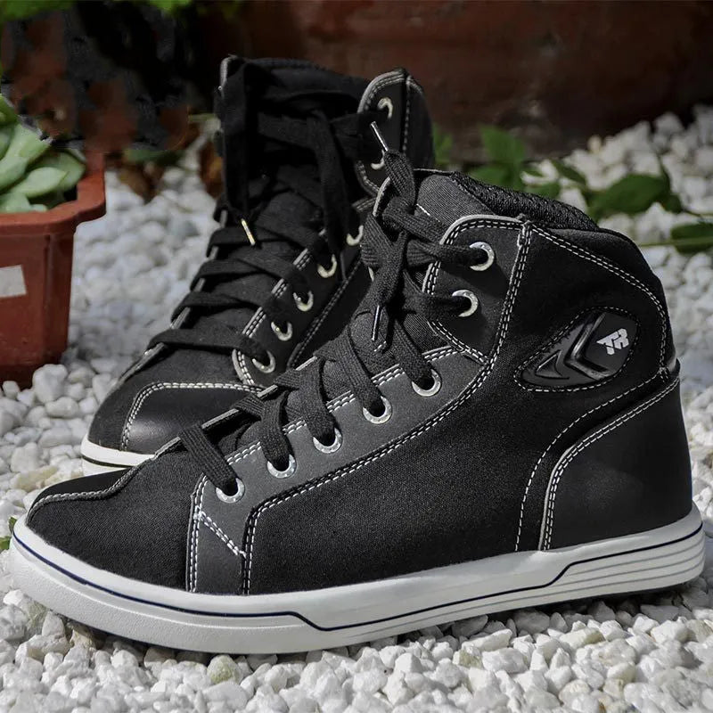 Black and grey motorcycle riding shoes showing short boot design with anti-fall sole pattern