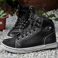 Black and grey motorcycle riding shoes showing short boot design with anti-fall sole pattern