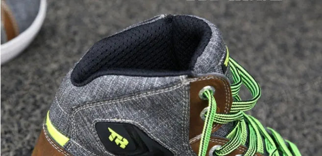 Black and grey motorcycle riding shoes showing short boot design with anti-fall sole pattern